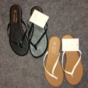 Two NWT black and white flip flops